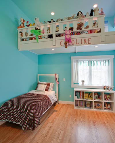 This kids' room has its own clubhouse'near the ceiling.  The unusually high ceilings in this room begged for a hideaway, and a place to keep all those stuffed animals