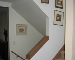 Before: Classic '80s stairs with knee walls and carpet had to go