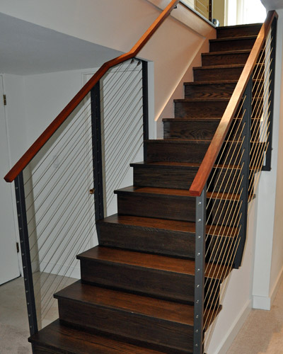 The new railings, treads and risers are visible from top and bottom and signal that the time for change has finally come to this '60s home.  Next phase - basement or kitchen?  We're looking forward to finding out