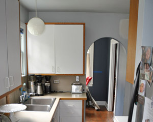 Before:  a cramped eating nook beyond the kitchen is mostly wasted space