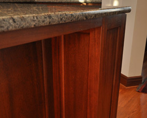 The island features furniture styling, including these pillars on the rear of the cabinetry
