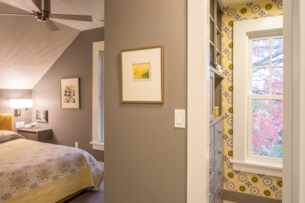 The use of built-in cabinets at the bed area makes the bedroom cozy and functional