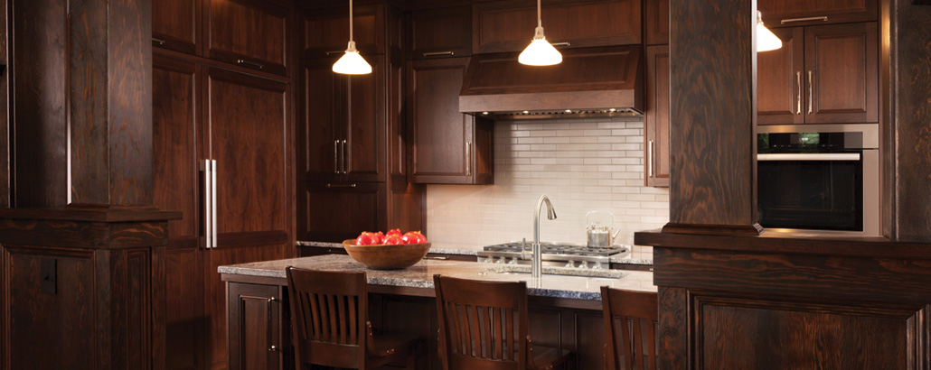 walnut custom kitchen cabinets with Azul Aran granite counters