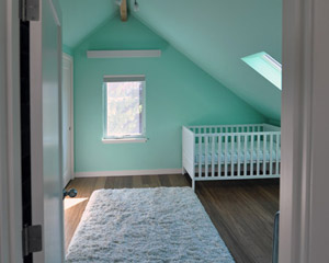 The nursery also benefits from added closet space carved out of the side attic