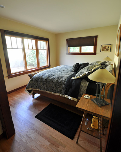 A light-filled master bedroom looks out on the fenced backyard'private but spacious. master suite addition Seattle