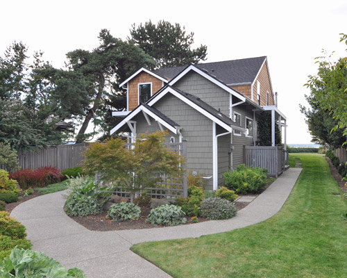 The finished home is beautiful on approach to the front door, with consistent trim and siding, and new paint throughout, dormer addition seattle