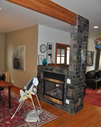 The previous incarnation had the fireplace tiled - badly and set off visually from the dining area