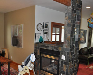 The previous incarnation had the fireplace tiled - badly and set off visually from the dining area