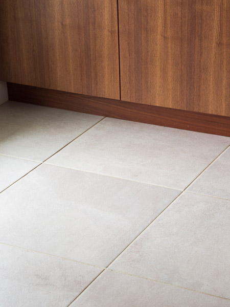 Tile also features prominently in the kitchen and dining room areas, chosen specifically knowing how much sand may be tracked into the house