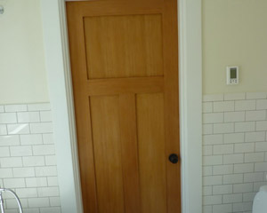 A lingering concern as the project was planned was how to eliminate the old door into the bedroom.  It was in the middle of a room with tile wainscot and it was unclear if that or the floor tile could be located