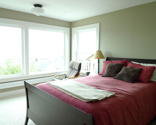 The master bedroom remodel is now smaller but light and bright.  Larger windows provide a panoramic view of downtown Seattle, master suite remodel seattle