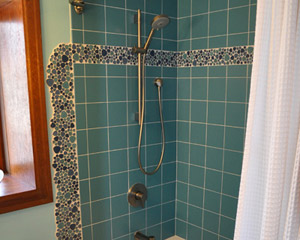 After seeing how great it looked at the vanity, the clients decided to repeat the pool at the tub shower area.  The results are striking. Seattle custom tile