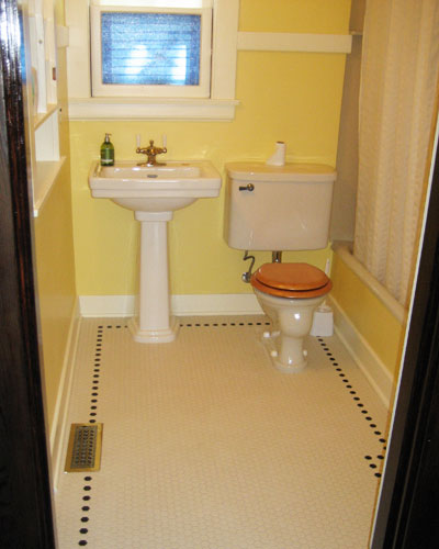 A minor bathroom remodel at the main floor is part of the project, with new hex tile and paint.  The vintage toilet remains