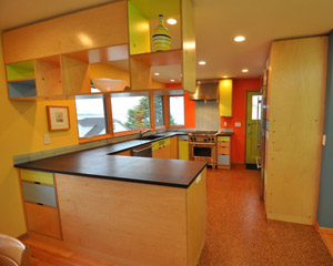 clean lines, green materials, and brightly painted walls. A unique and playful mid-century modern kitchen, Seattle kitchen remodel
